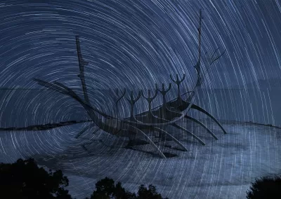 A Scandinavian boat overlaid with a swirling sky of stars