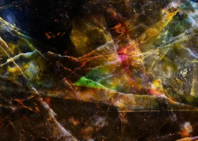 Mineral cracks arise on an iridescent background